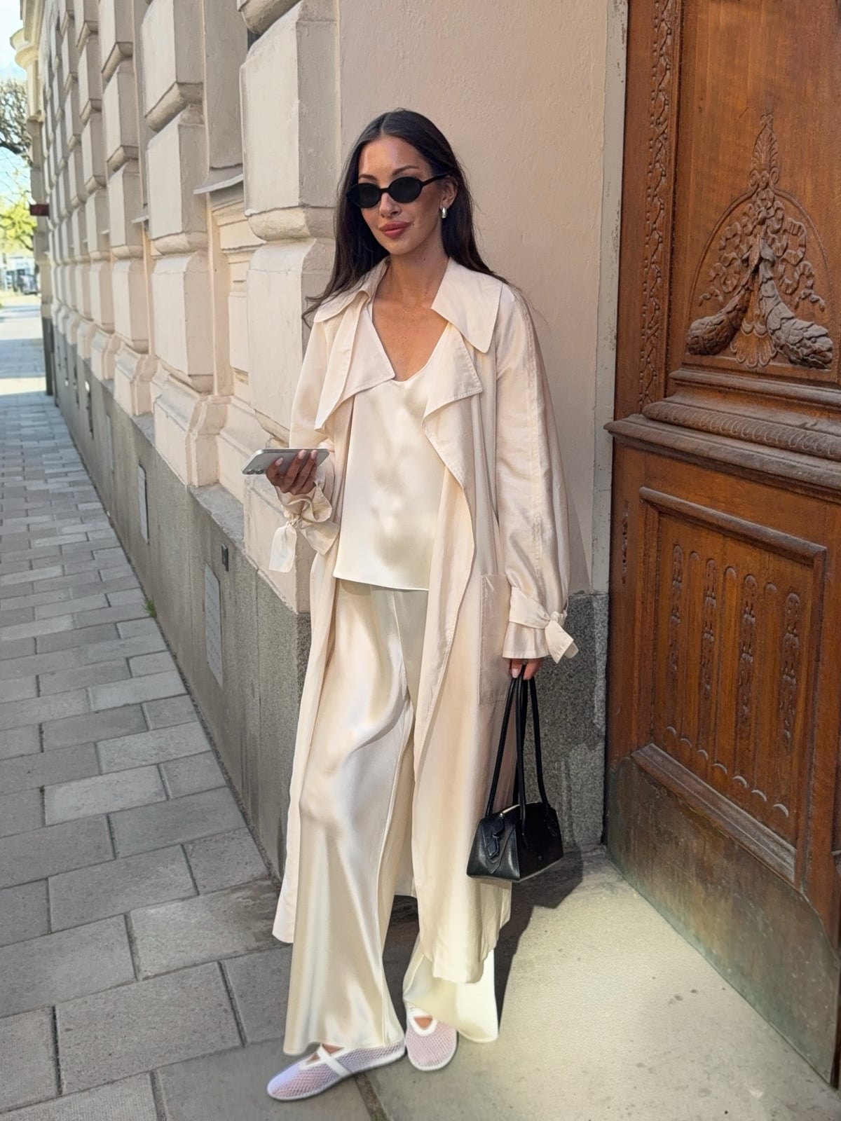 Ivory satin wide-leg trousers with a matching trench coat — Simple Beige Pants Outfits