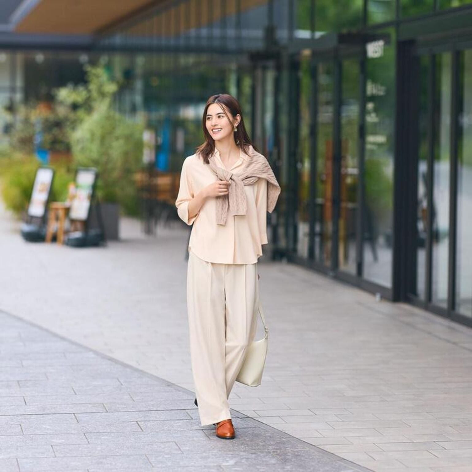 Relaxed fit beige pants with a cream button-up and draped sweater — Simple Beige Pants Outfits