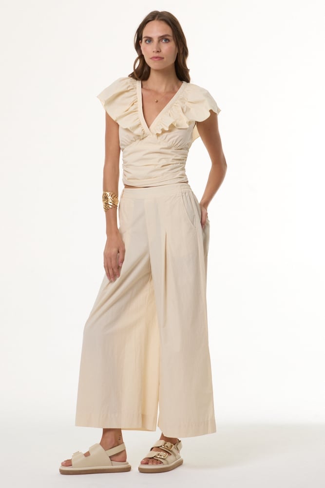 Beige wide-leg pants with a cream ruffled top — Simple Beige Pants Outfits