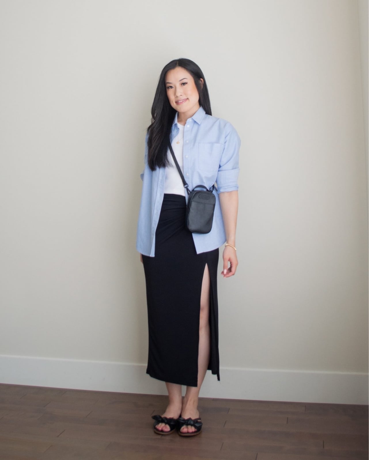 Blue button-down shirt over white tee with black maxi skirt Blue button-down shirt over white tee with black maxi skirt — Simple Blue Top Outfits