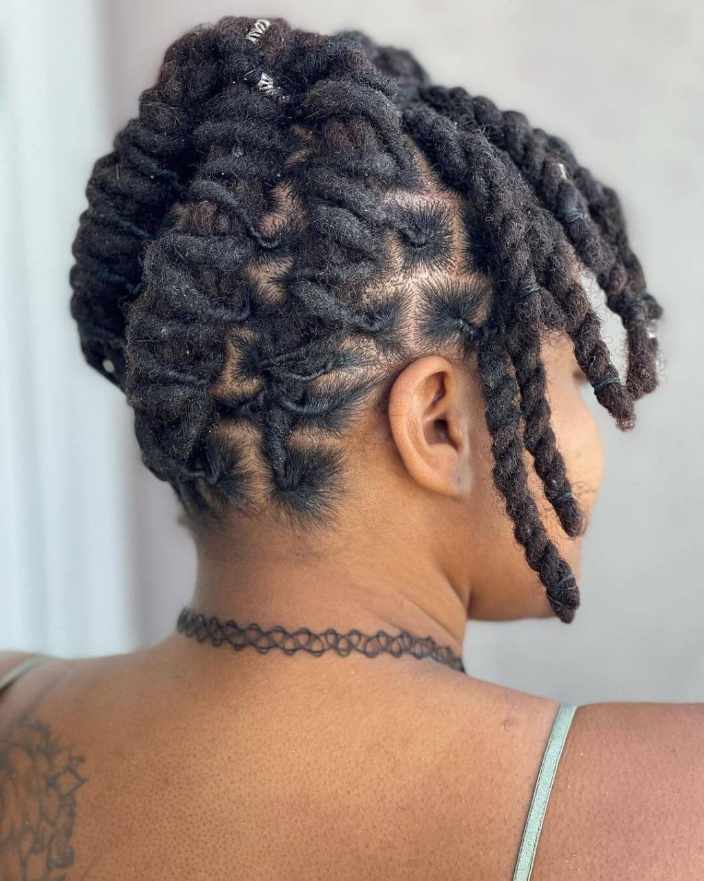Mid-Back Dark Brown Coily Locs Ponytail, Close-Up Take Mid-Back Dark Brown Coily Locs Ponytail, Close-Up Take — Simple Braids Locs