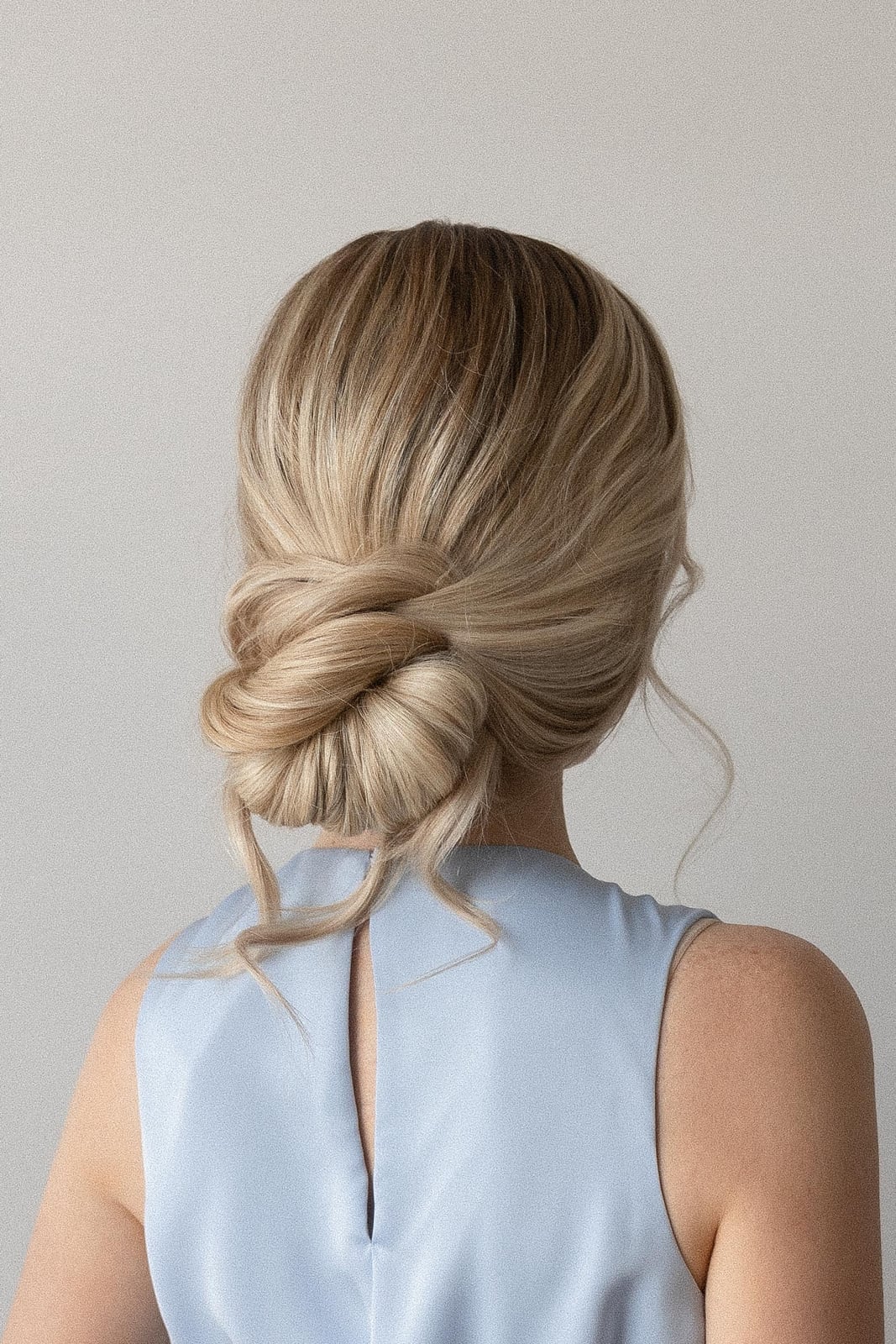 Ash Blonde Low Updo With Wispy Tendrils — Simple Bridesmaid Updos