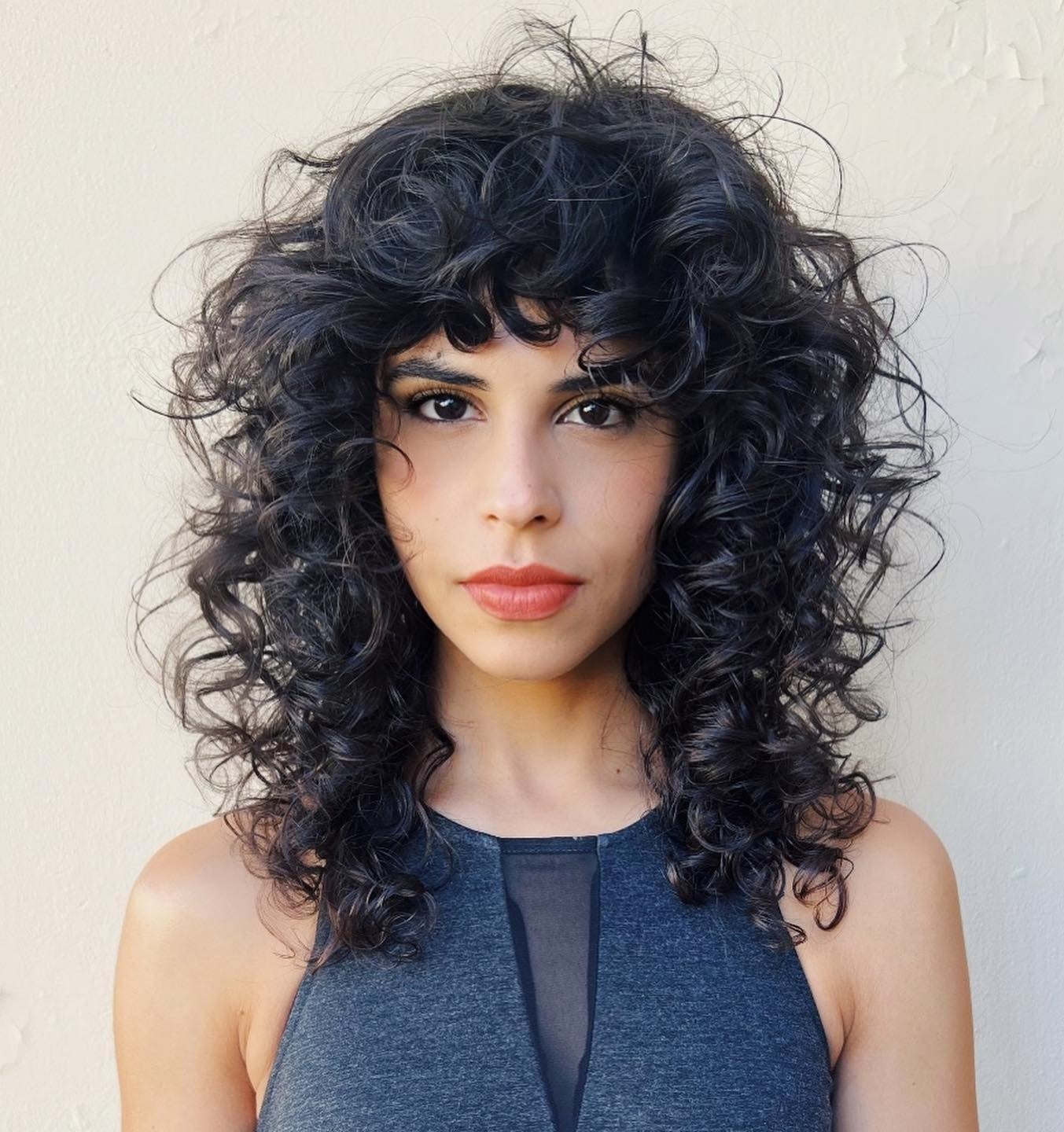Mid-Back Curly Wolf Cut With Curtain Bangs — Simple Curly Wolf Cut