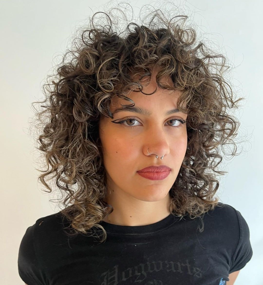 Shoulder Length Wolf Cut With Short Choppy Bangs — Simple Curly Wolf Cut