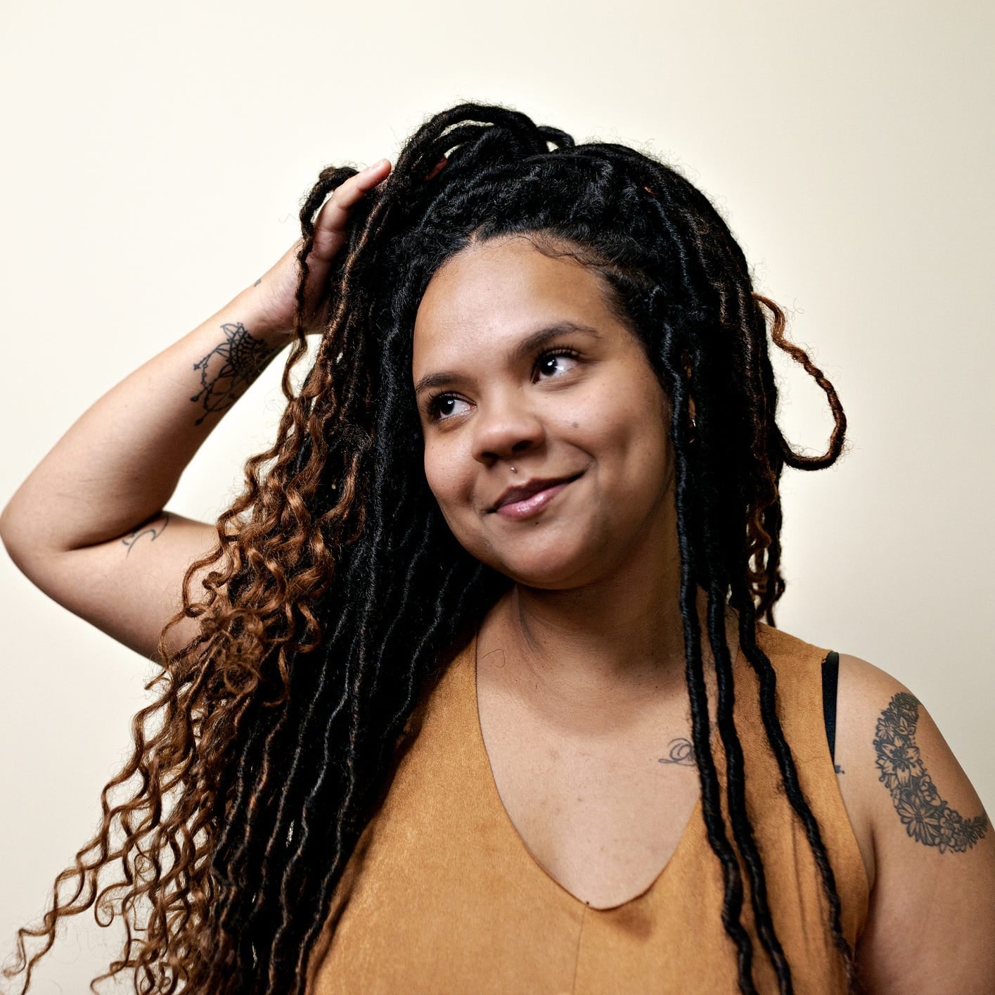 Mid-Back Faux Locs with Highlights and Curls Mid-Back Faux Locs with Highlights and Curls — Simple Down Locs