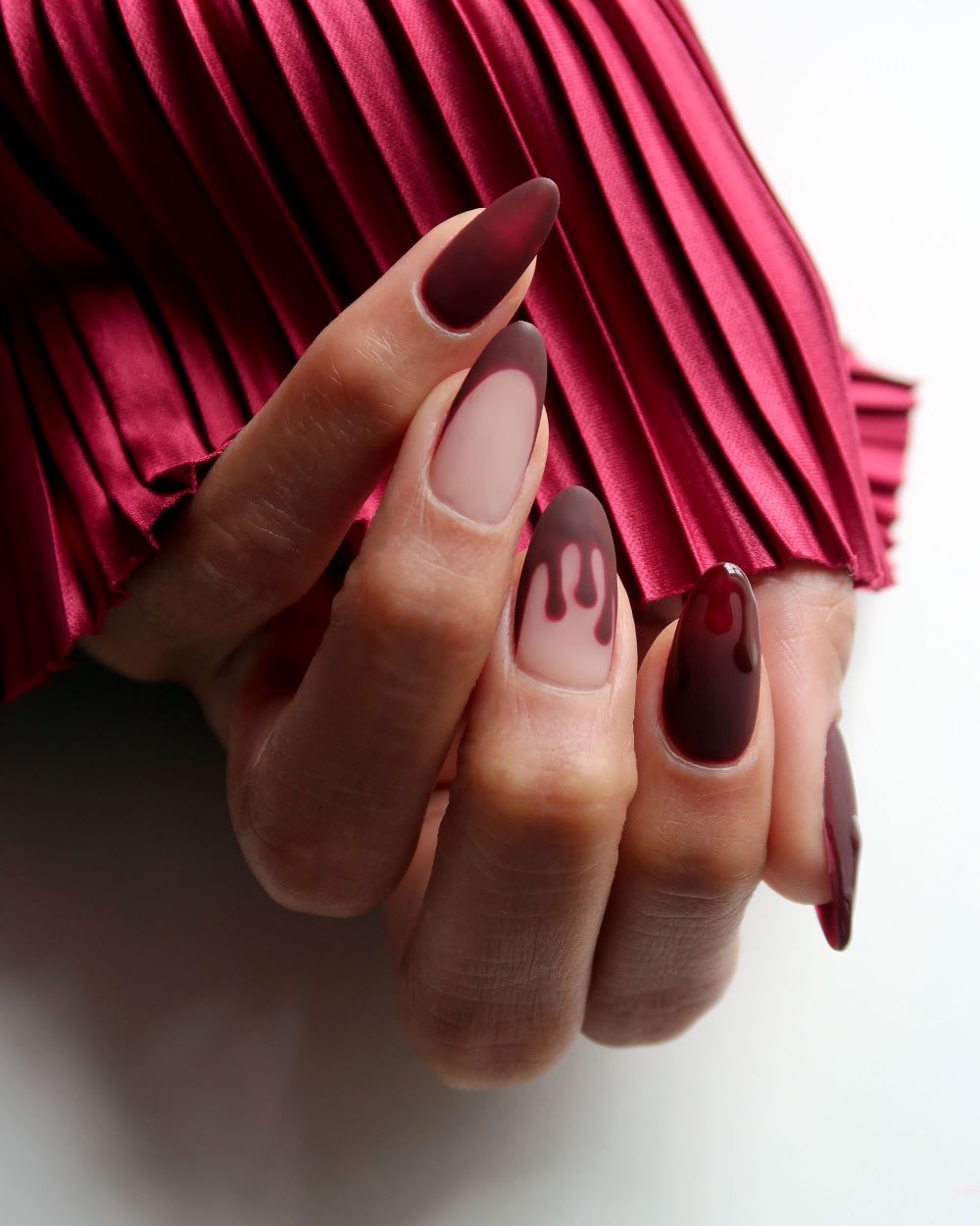 Chic Nude Oval with Red Drip Accents — Simple Drip Nails