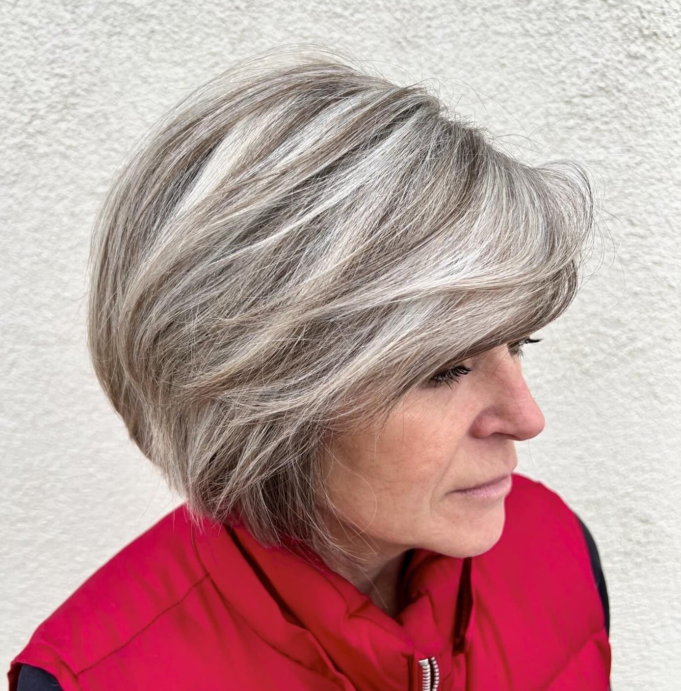 Chin Length Layered Bob With Side Swept Bangs — Simple Gray Blending Hair
