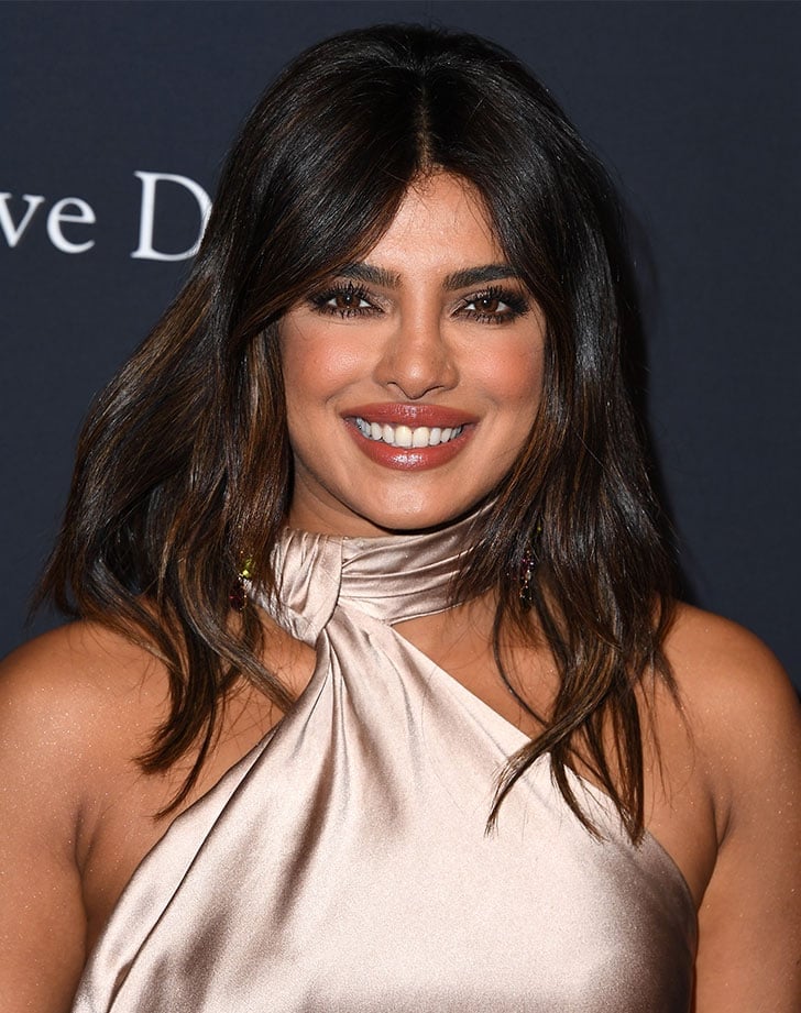 Collarbone Layers With Subtle Highlights — Simple Haircuts for Wavy Hair