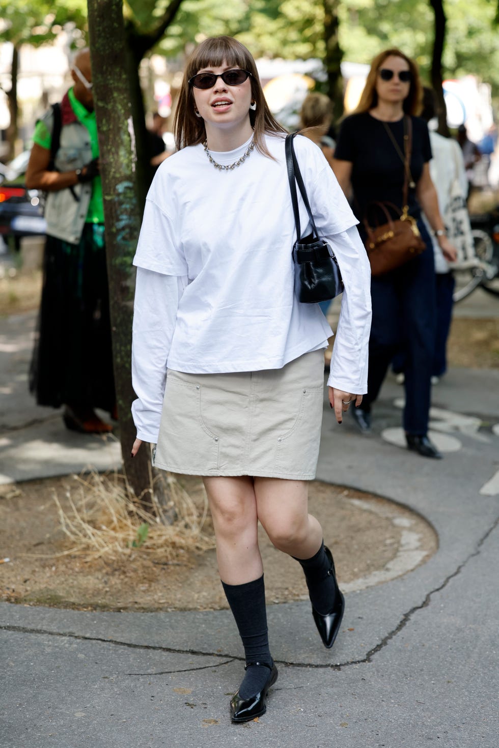 Layered t-shirts with denim mini skirt and pointed flats — Simple Layered Ideas