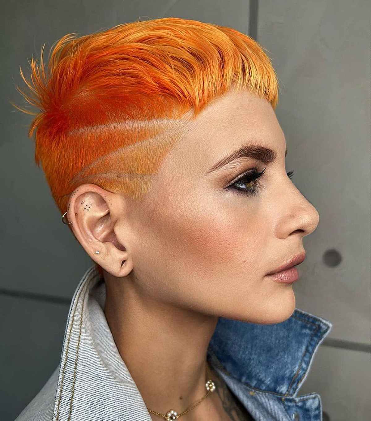 Vibrant Orange Pixie With Shaved Sides — Simple Lesbian Haircuts