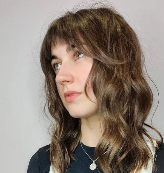 Medium Brown Shag With Curtain Bangs — Simple Lesbian Haircuts