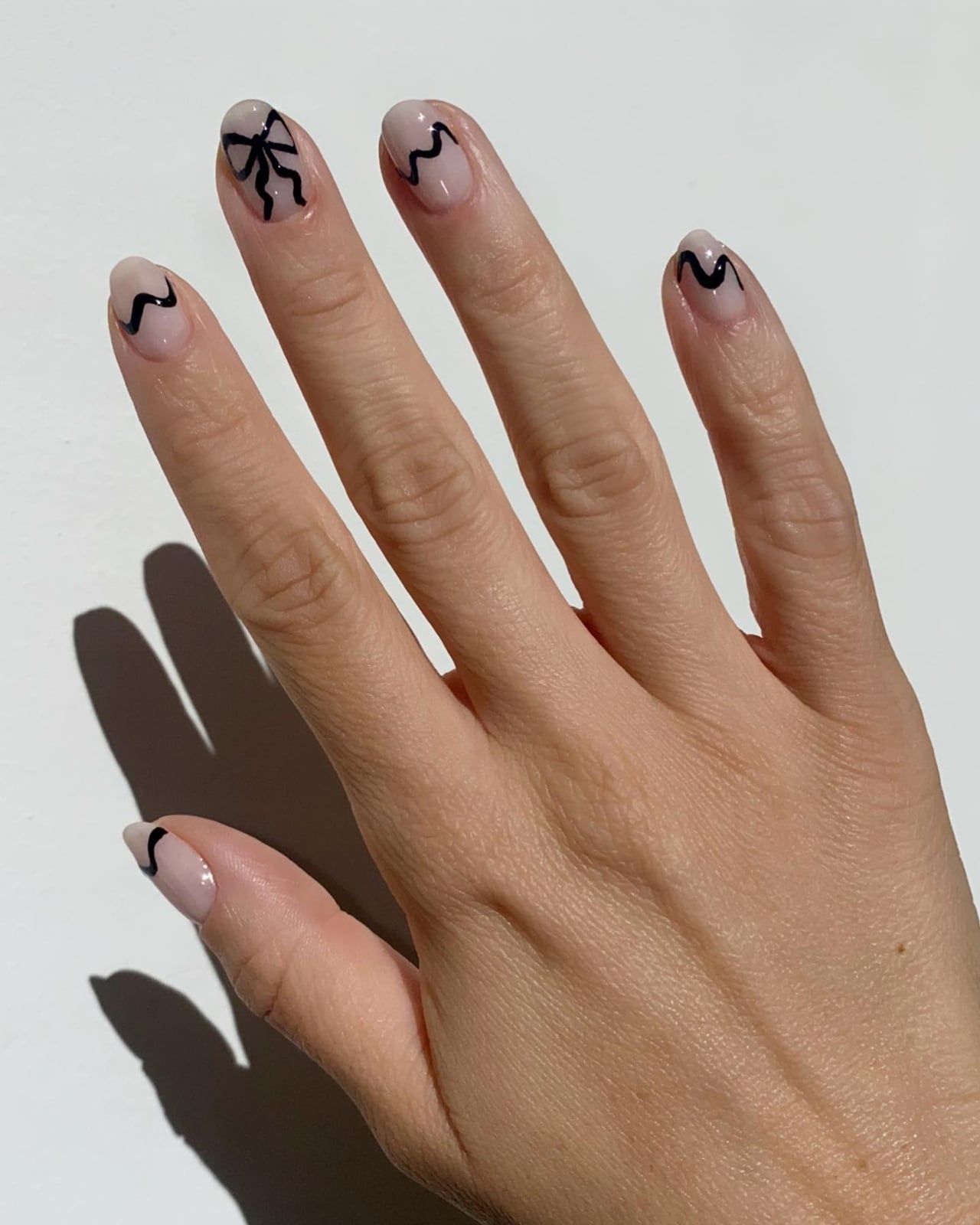 Black Ribbon Bow Sheer Nude Short Oval Nails — Simple Looks Nail