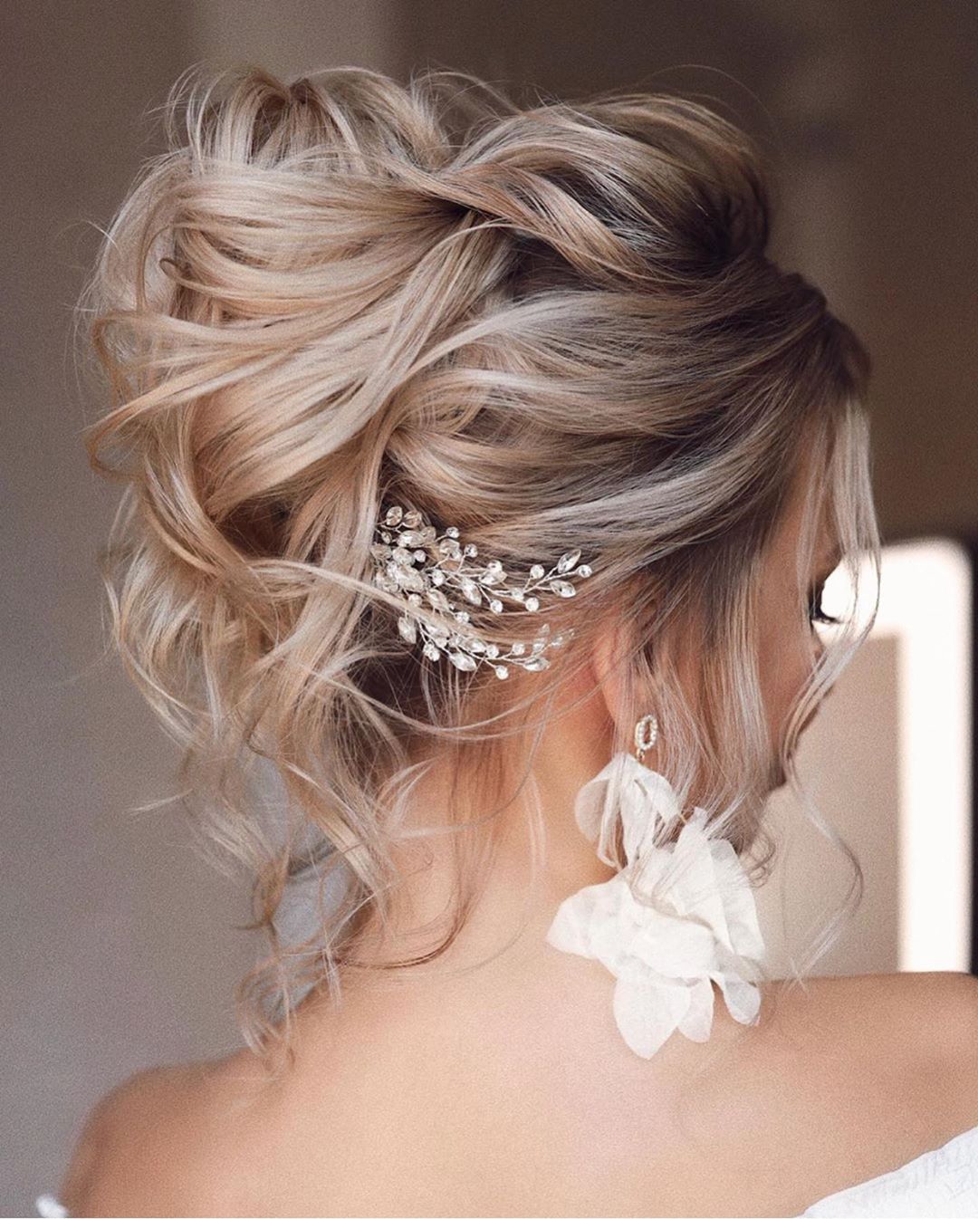 Platinum Blonde Updo with Sparkling Accessory Platinum Blonde Updo with Sparkling Accessory — Simple Loose Updo