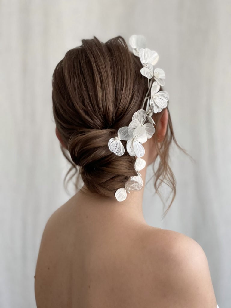 Medium Brown Wavy Low Updo With Flowers — Simple Low Bun Wedding Hair