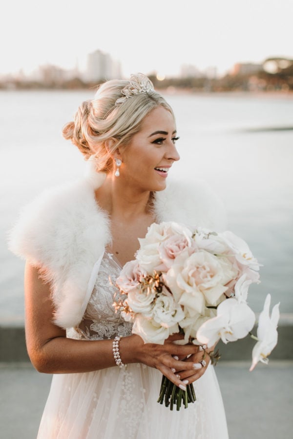 Blonde Wavy Low Bun With Sparkling Tiara — Simple Low Bun Wedding Hair