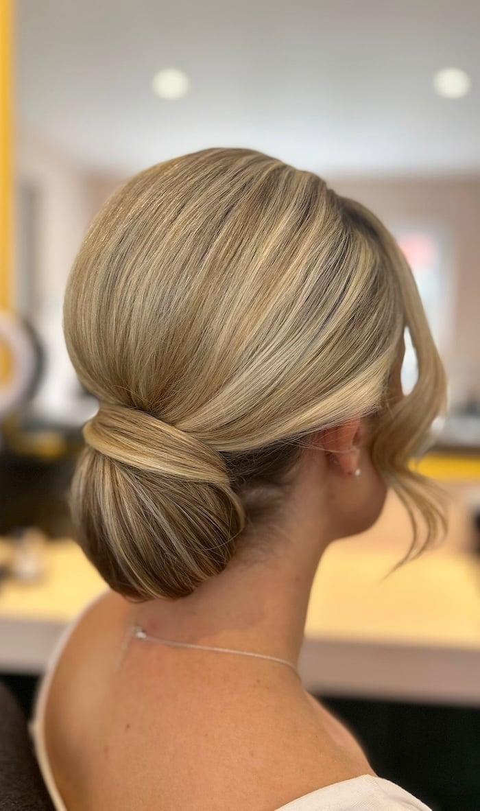 Blonde Wavy Low Twisted Bun Side Part — Simple Low Bun Wedding Hair