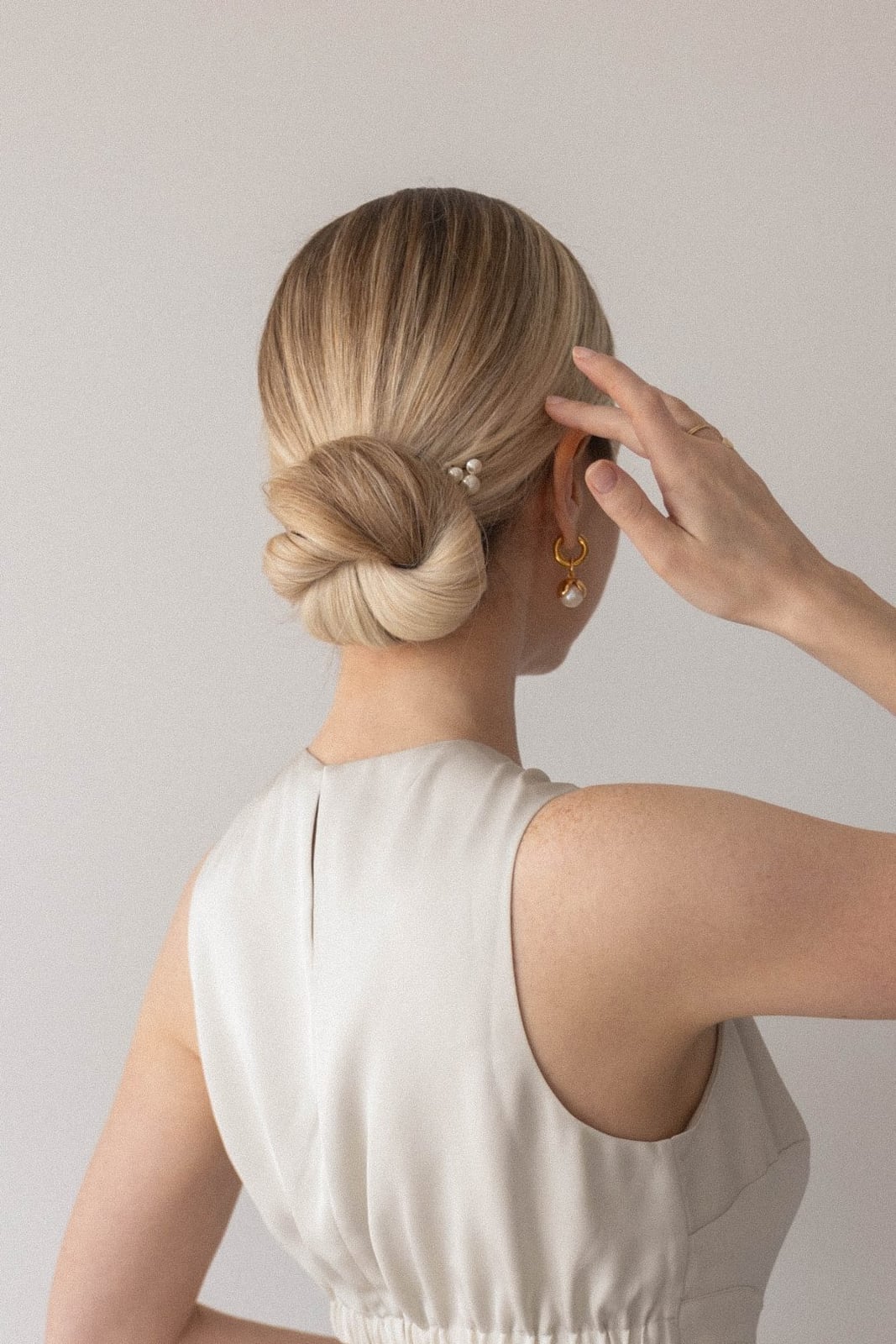 Blonde Low Bun With Pearl Accessory — Simple Low Bun Wedding Hair