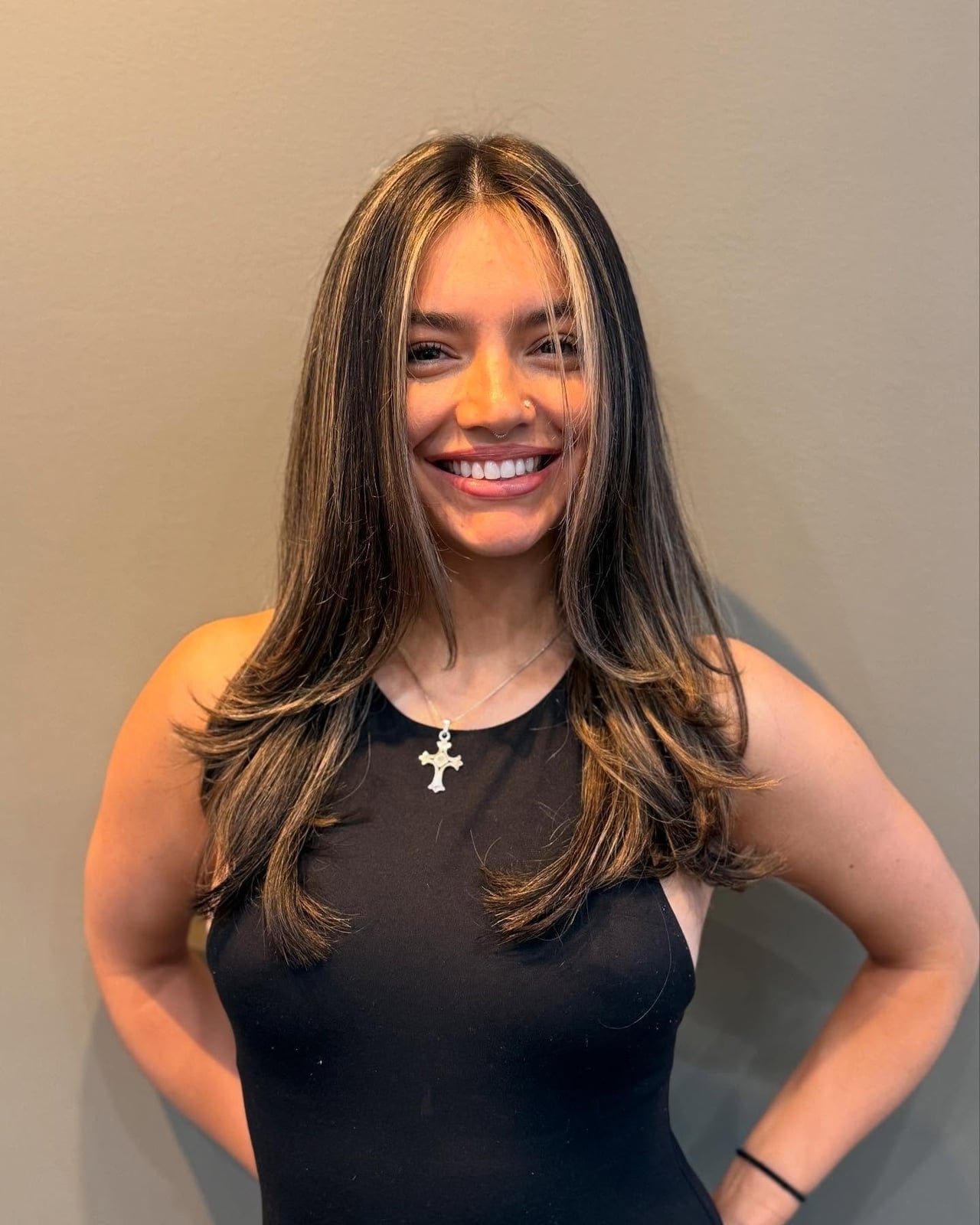 Sleeveless black top and silver necklace complement blonde money — Simple Money Piece