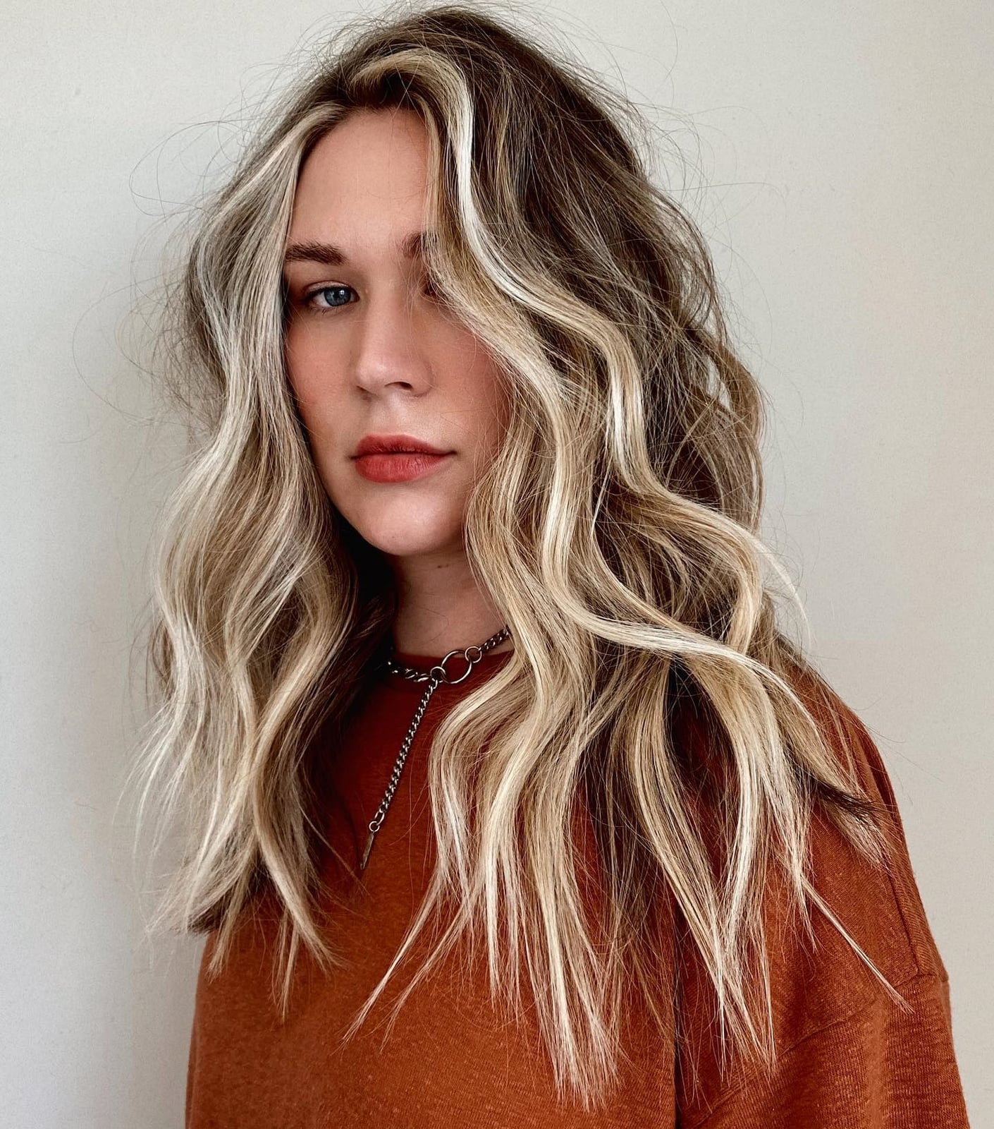 Rust knit sweater and silver chain complement blonde money piece — Simple Money Piece