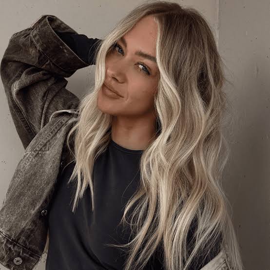 Denim jacket over a t-shirt creates a casual vibe with blonde money — Simple Money Piece