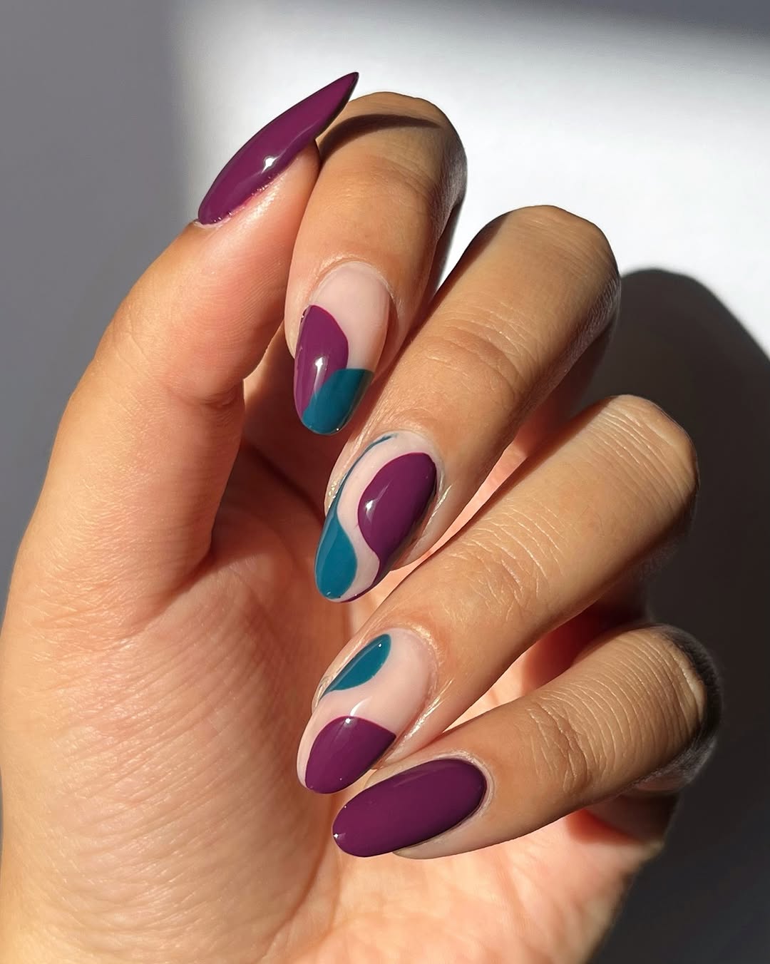Nude Short Almond With Purple Teal Abstract Shapes Nude Short Almond With Purple Teal Abstract Shapes — Simple Nail Shapes