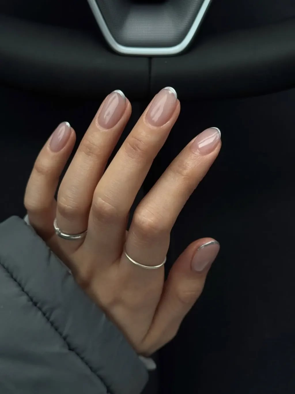 Sheer Nude Medium Oval Nails With Thin White French Tip, Close-Up Take Sheer Nude Medium Oval Nails With Thin White French Tip, Close-Up Take — Simple Nail Shapes