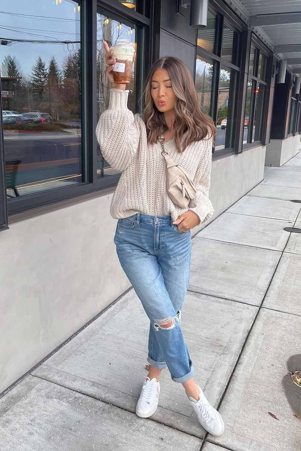 Distressed Straight Leg Jeans With Beige Knit Sweater And Sneakers — Simple Ripped Jeans Outfits