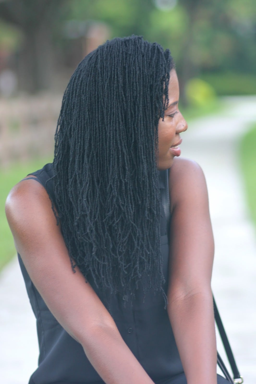 Mid-Back Black Coily Micro Locs Loose Style — Simple Sister Locs