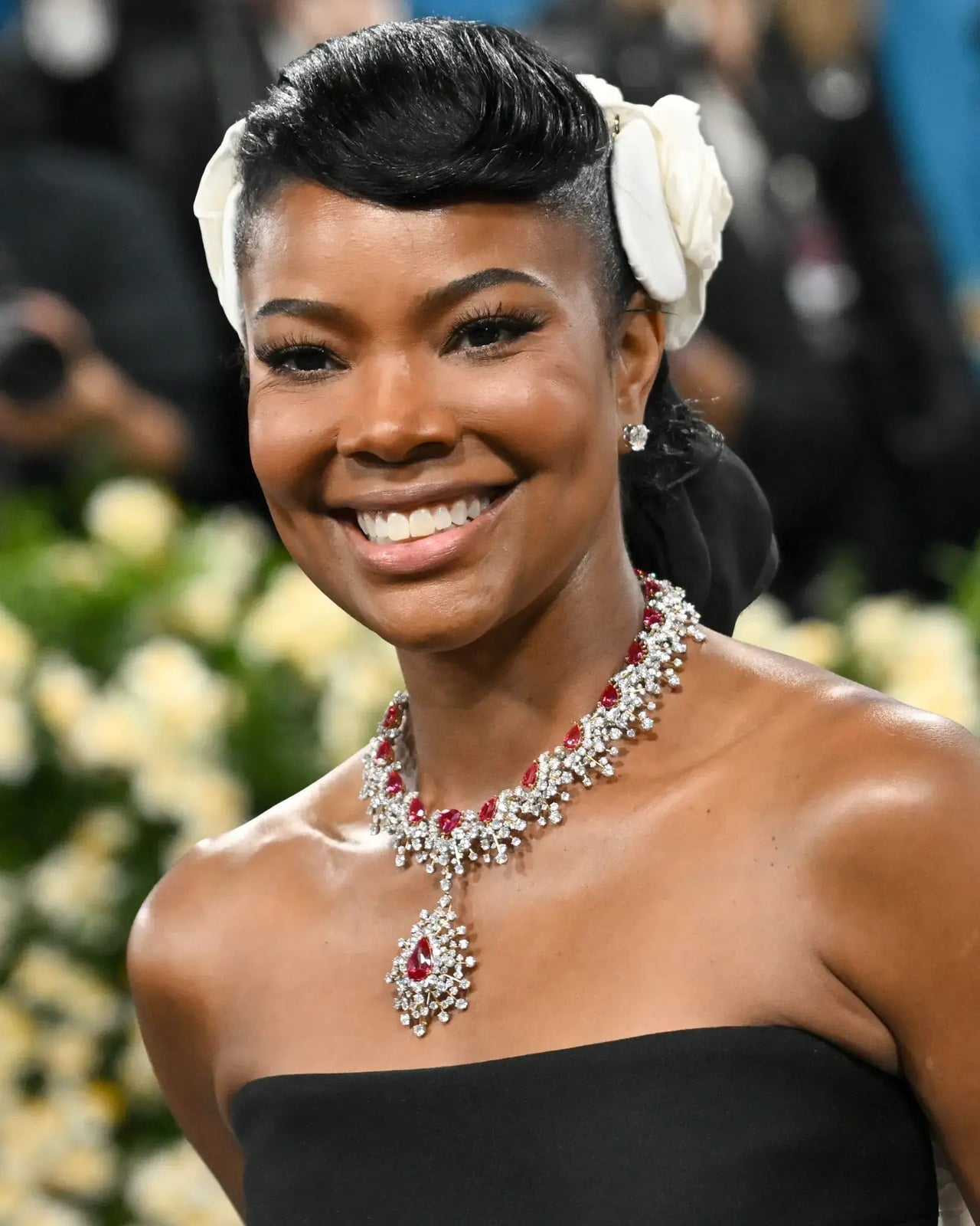 Fine Black Sleek High Updo With Flower — Simple Strapless Dresses Hairstyles