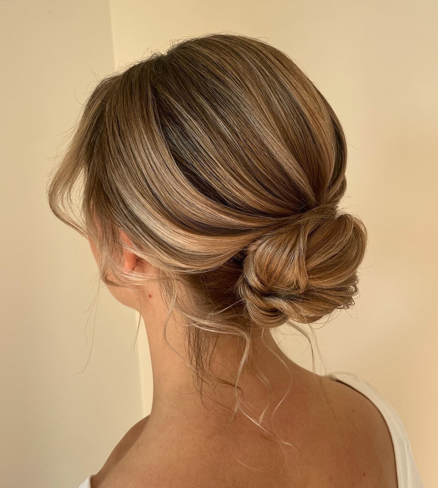 Textured Low Bun With Face-Framing Pieces Textured Low Bun With Face-Framing Pieces — Simple Updo Hair