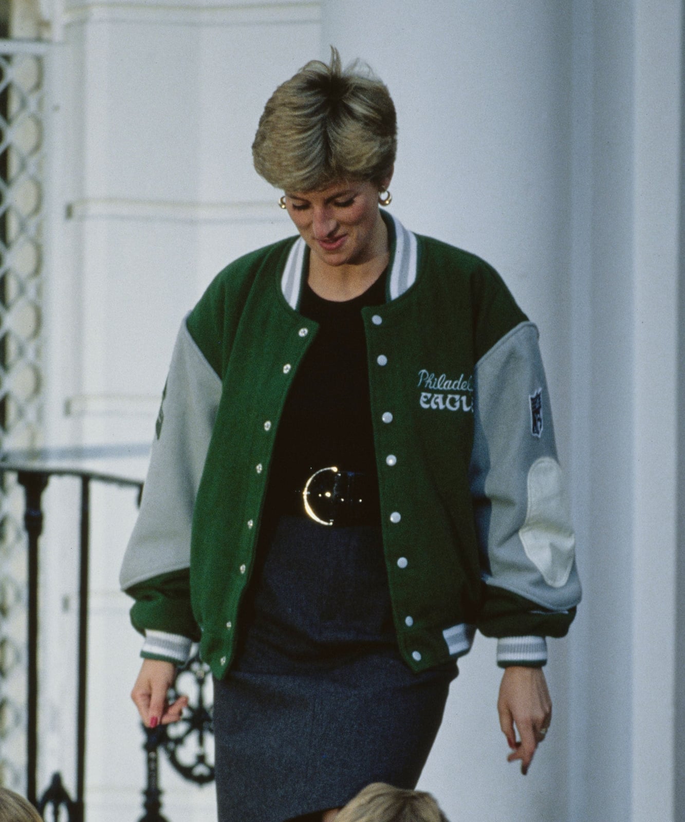 Green Varsity Jacket With Dark Skirt — Simple Varsity Jacket Outfits