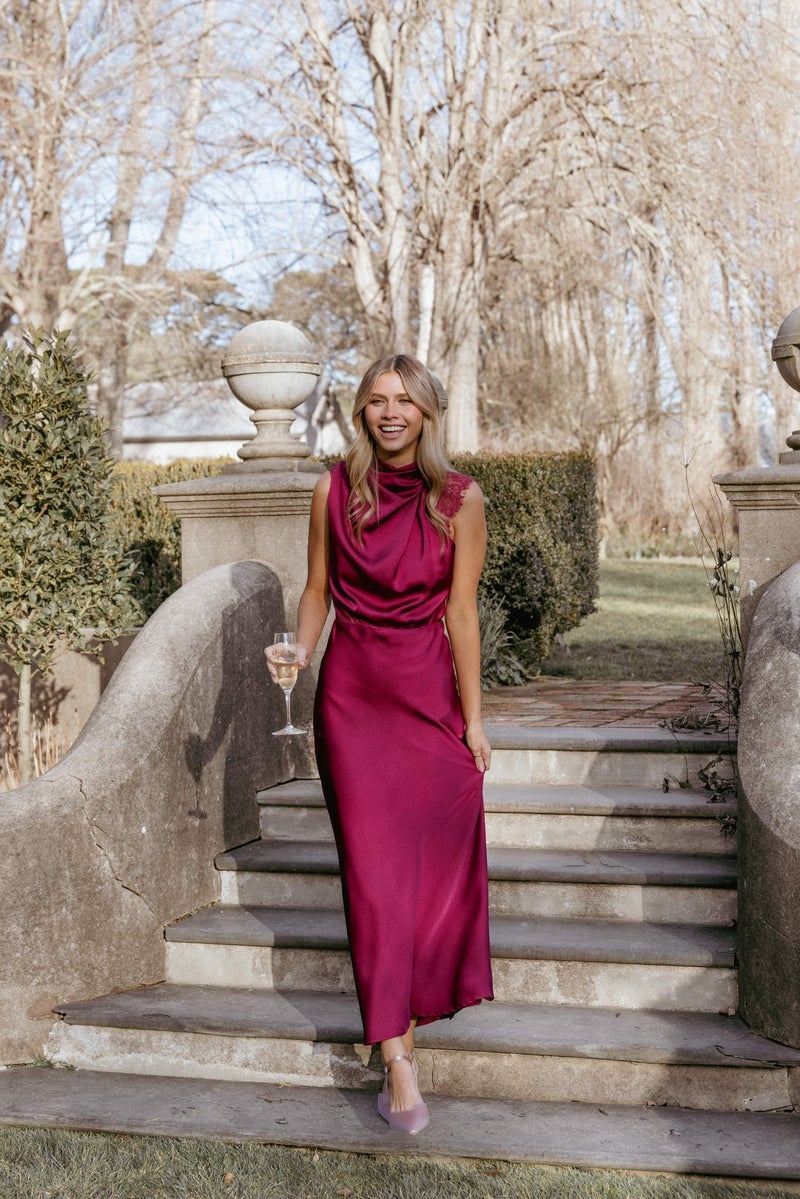 Magenta satin cowl neck maxi dress with flowy silhouette — Simple Wedding Guest Outfits