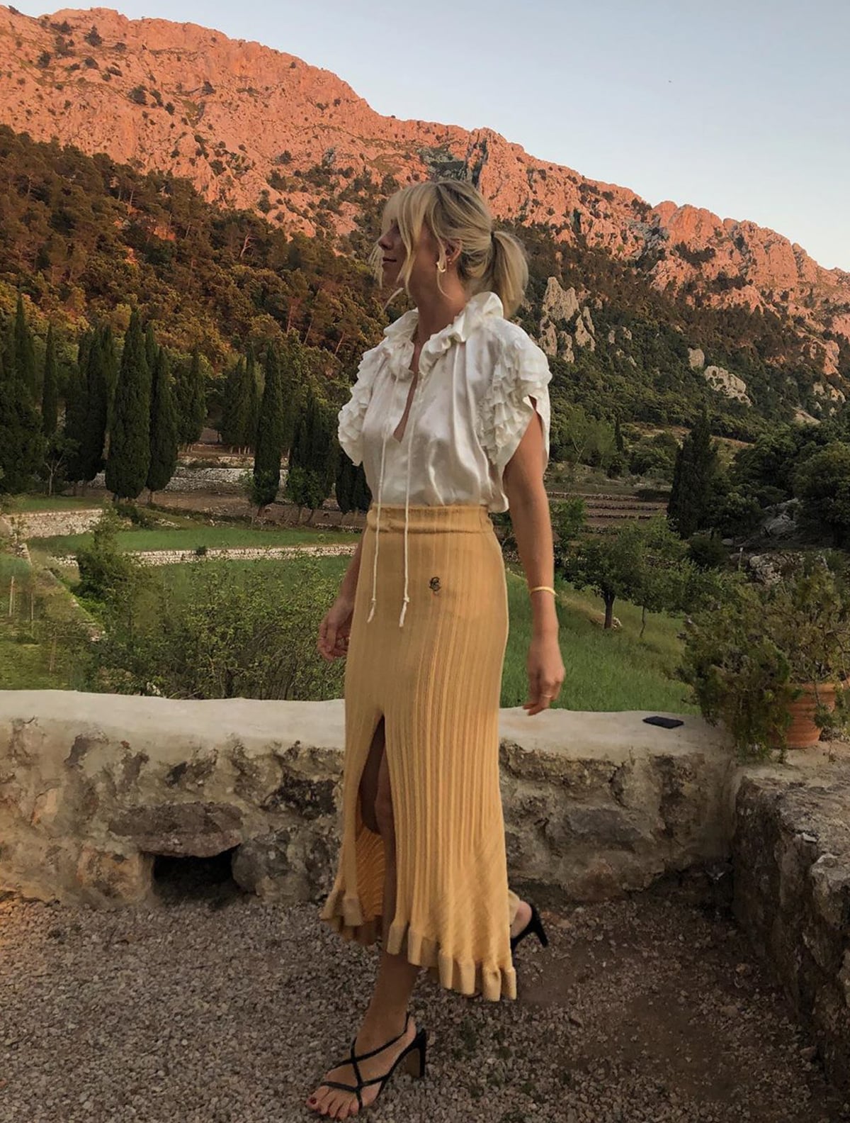 White ruffled blouse with yellow ribbed knit midi skirt — Simple Wedding Guest Outfits