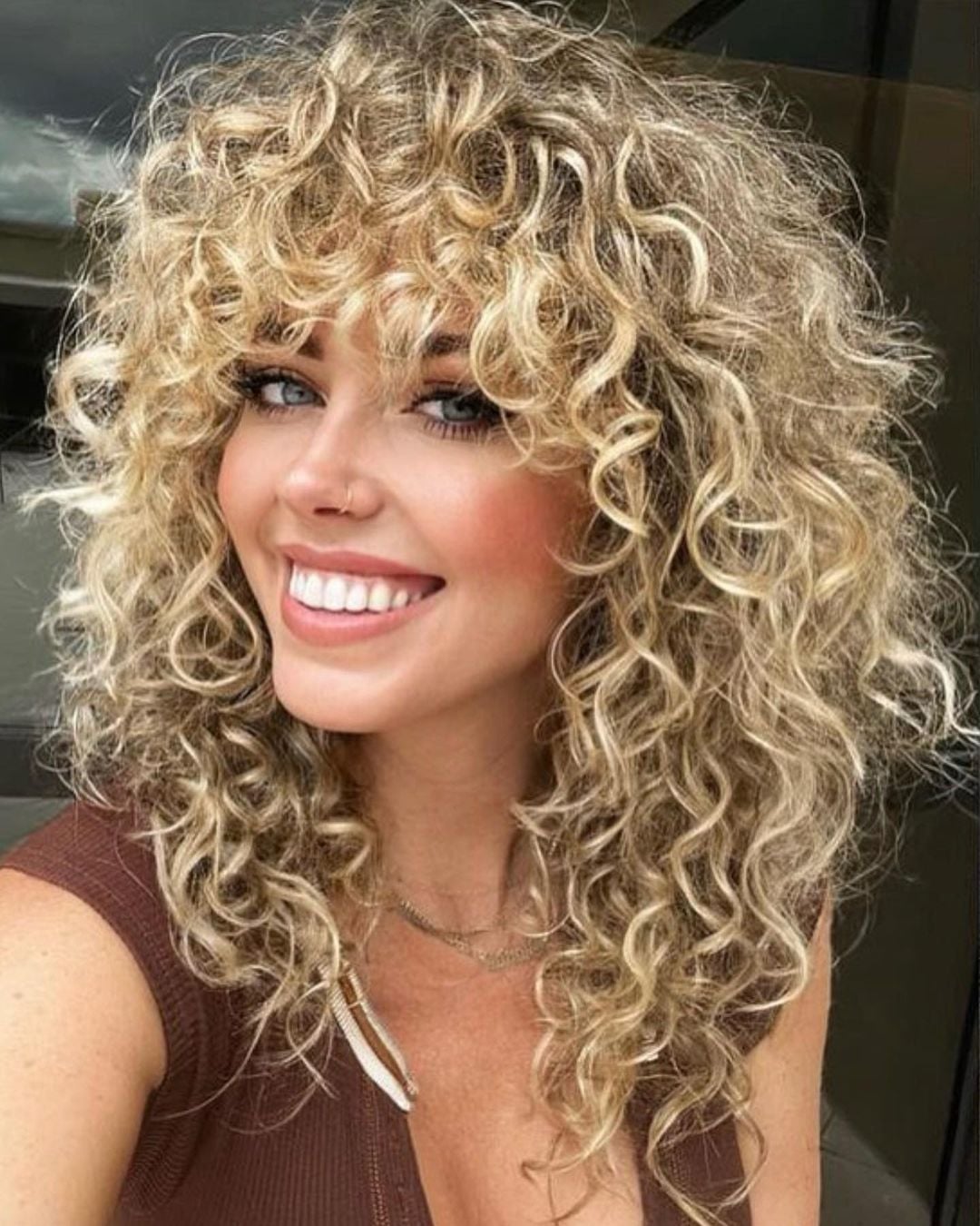 Shoulder Length Blonde Wolf Cut With Voluminous Curls — Simple Wolf Cut