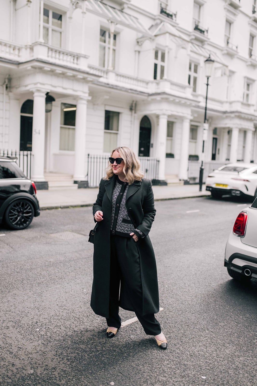 Long Dark Green Coat Over Knit Top and Wide-Leg Trousers Long Dark Green Coat Over Knit Top and Wide-Leg Trousers — Simple Work Party Outfits