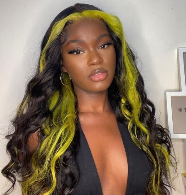 Mid-Back Blowout With Yellow Face Framing, A Woman With Thick — Skunk Stripe Hair