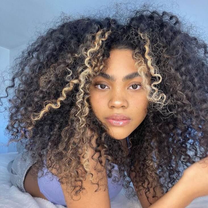 Mid-Back Curly Hair With Bold Blonde Stripes — Skunk Stripe Hair