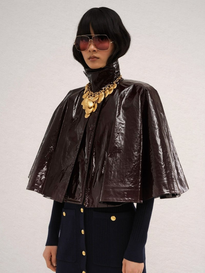 Patent Cape Over Navy Turtleneck and Skirt Patent Cape Over Navy Turtleneck and Skirt — Trendy 70s Style