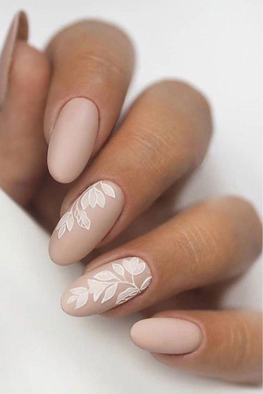 Matte Nude Almond Nails With White Floral Vines — Trendy Bridal Nails