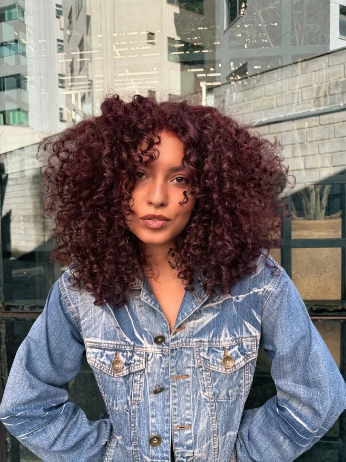 Collarbone Deep Plum With Auburn Undertones — Trendy Curly Hair Color
