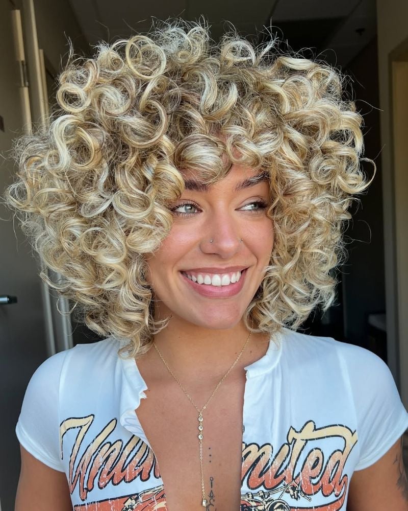 Chin Length Bob With Ash Blonde Highlights — Trendy Curly Hair Color