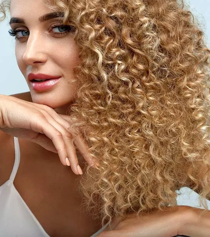 Mid-Back Ash Blonde Balayage — Trendy Curly Hair Color