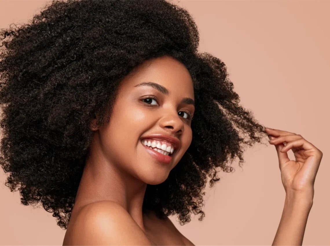 Mid-Back Natural Dark Brown Coily Hair — Trendy Curly Hair Color