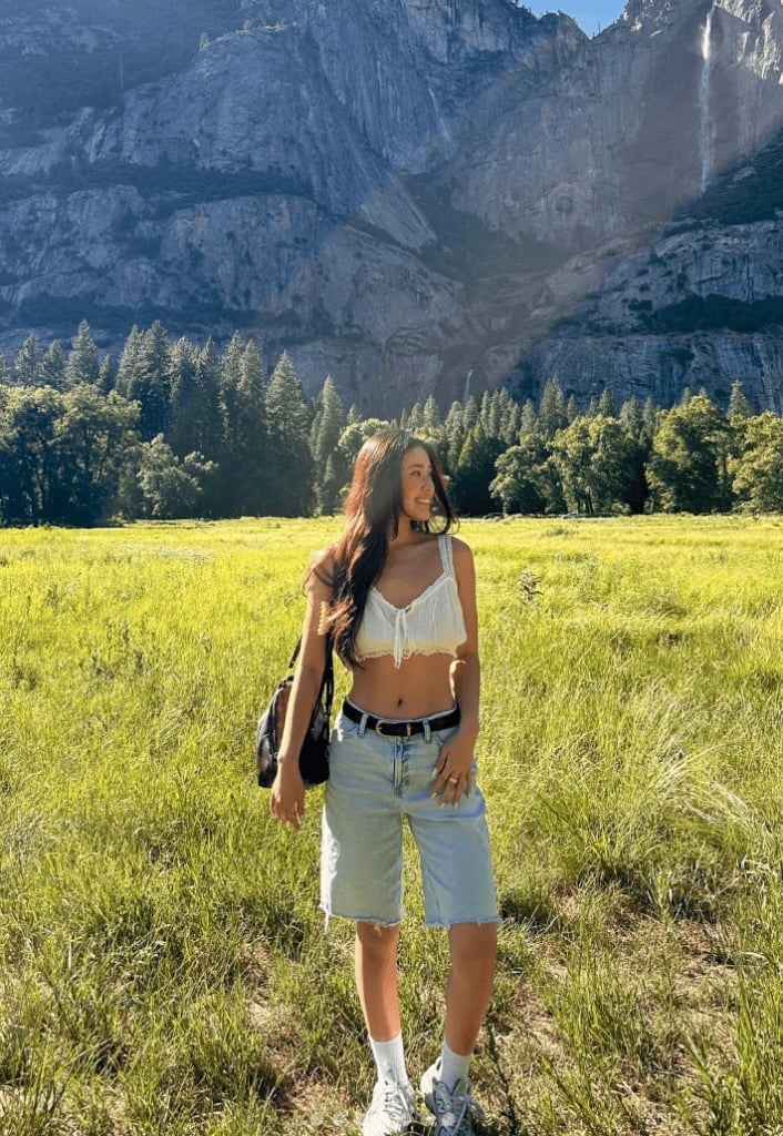 White Crop Top and Denim Shorts with Black Belt — Trendy Cute Hiking Outfit