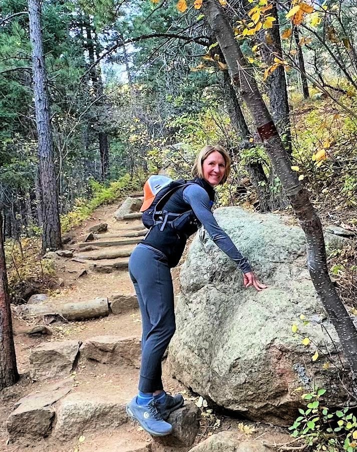 Gray Pants and Top with Black Vest and Orange Backpack — Trendy Cute Hiking Outfit