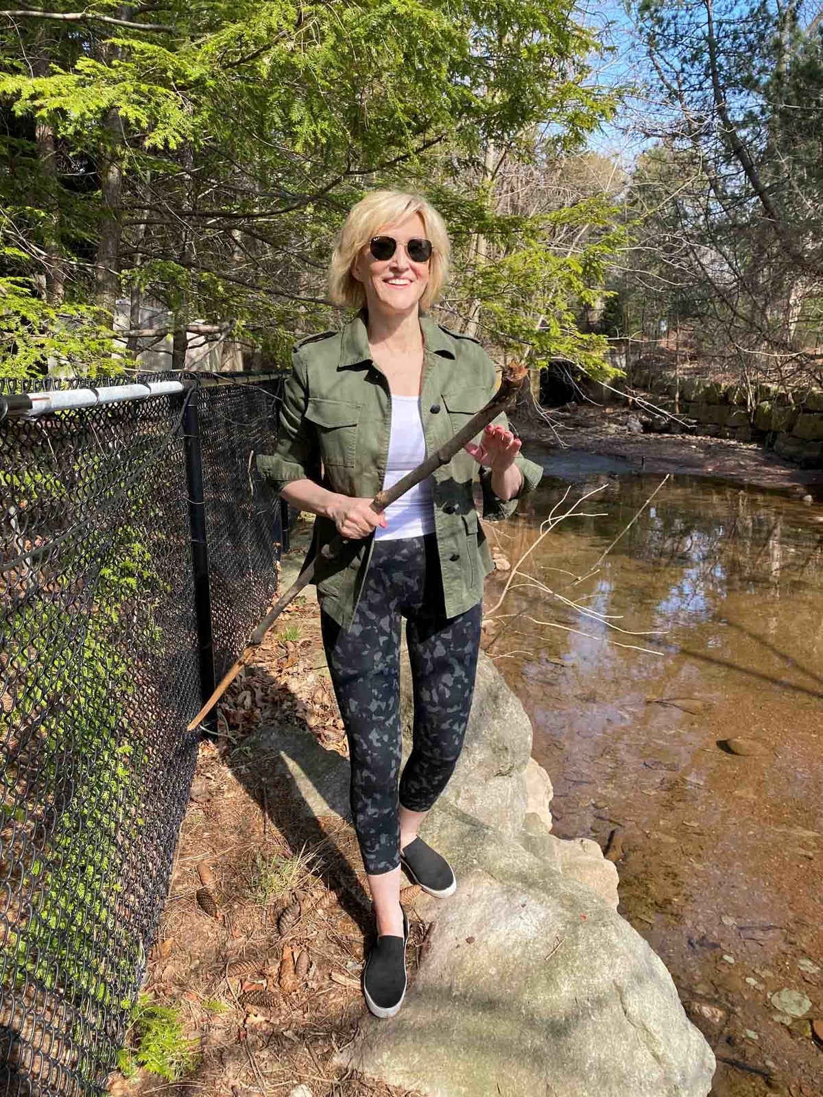 Olive Utility Jacket with Camouflage Leggings, Black Slip-On Sneakers — Trendy Cute Hiking Outfit