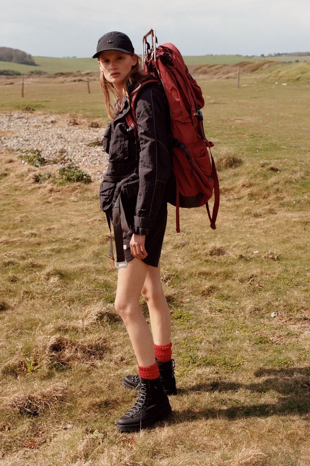 Black Jacket and Shorts with Red Backpack Accent — Trendy Cute Hiking Outfit
