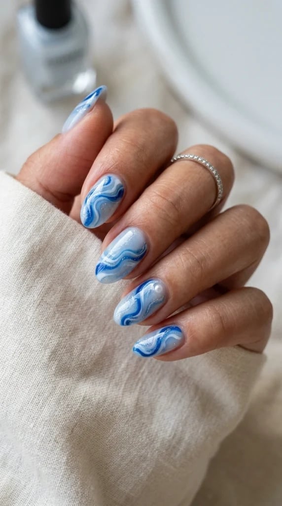 Realistic Blue and White Marble Short Almond Nails — Trendy Gel Nail Art