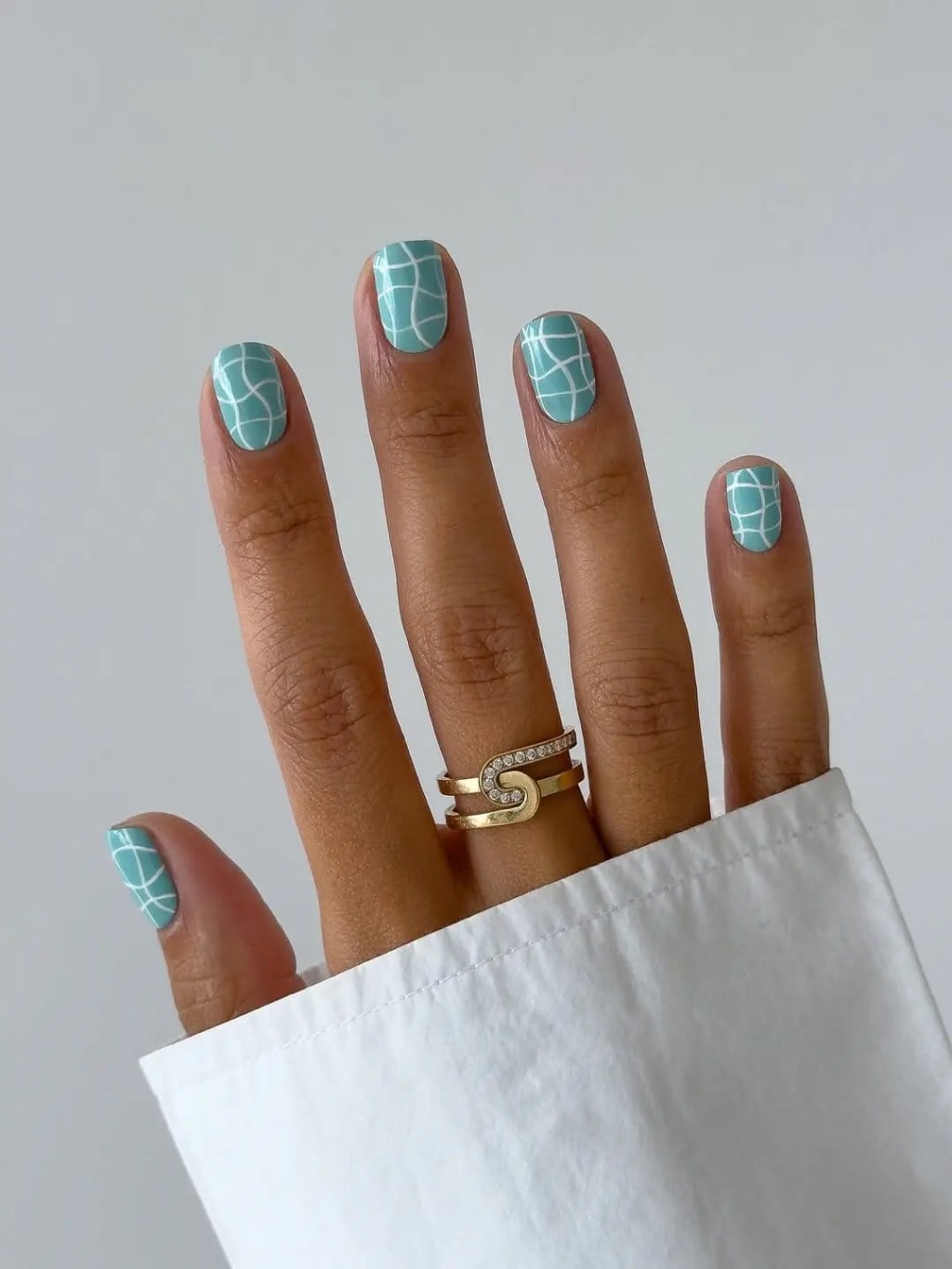 Teal Oval Nails with White Geometric Line Art — Trendy Gel Nail Art