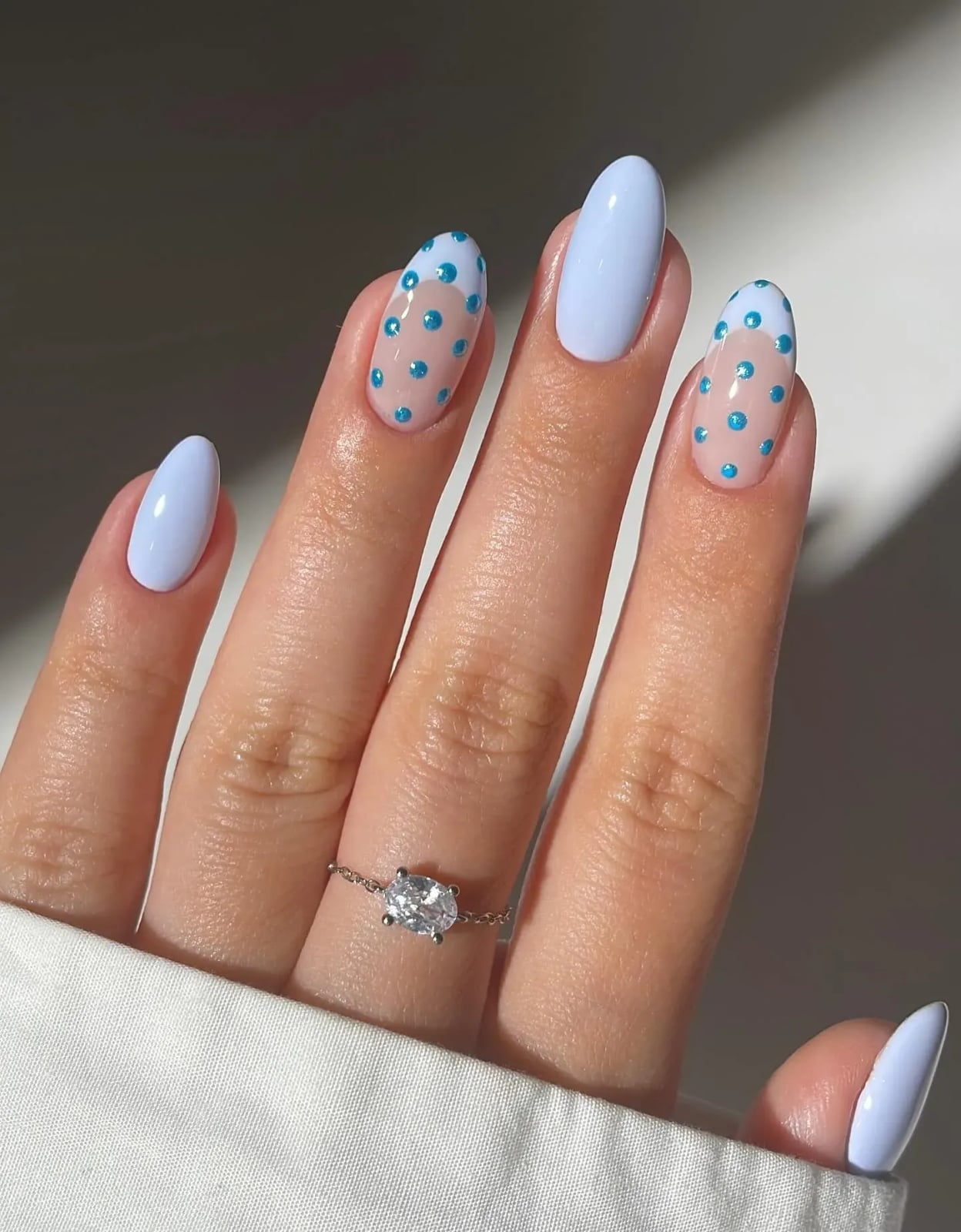 Milky White Oval Nails with Blue Polka Dots — Trendy Gel Nail Art